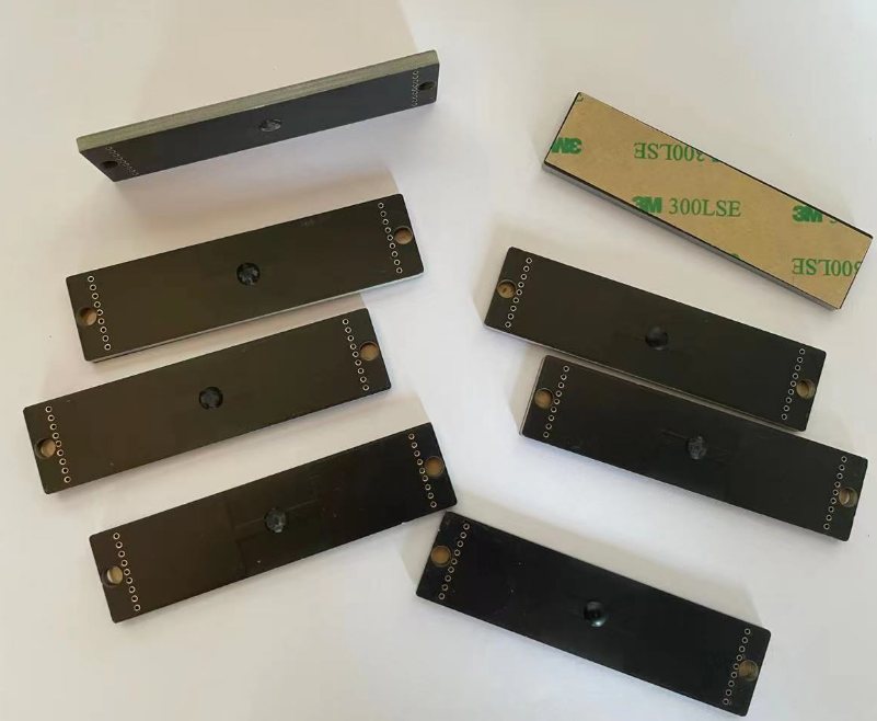 INF-7920 Asset Tag — on metal