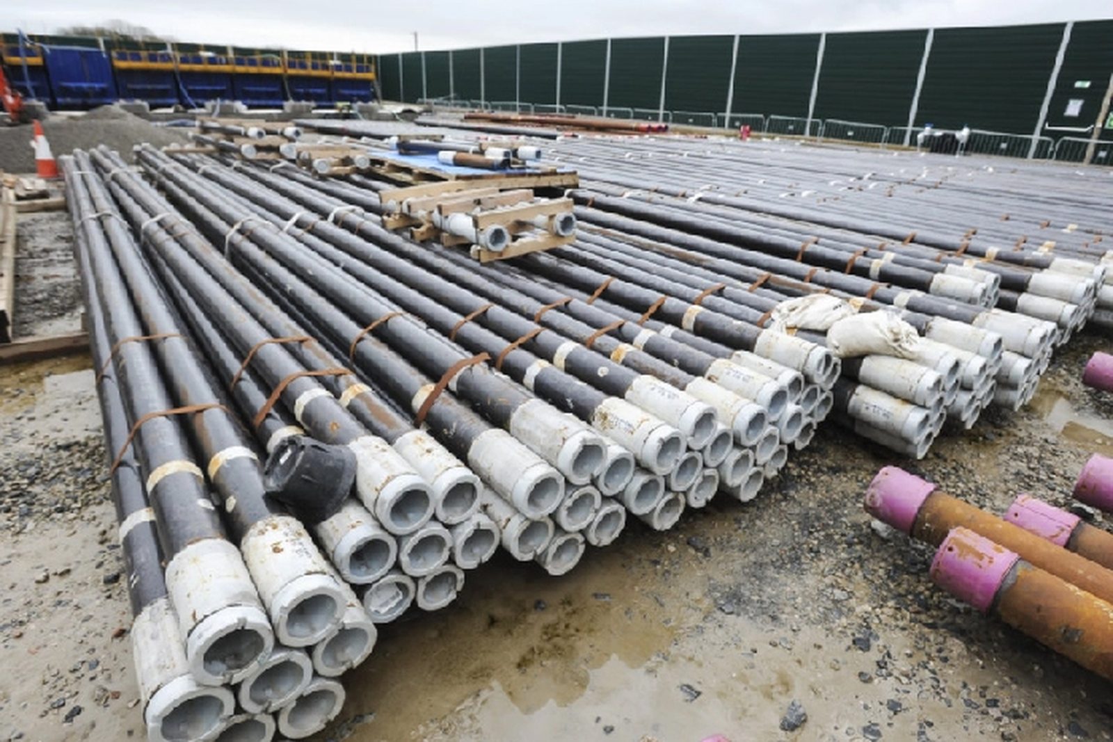 Open laydown yard with pipe and materials tracked by RFID