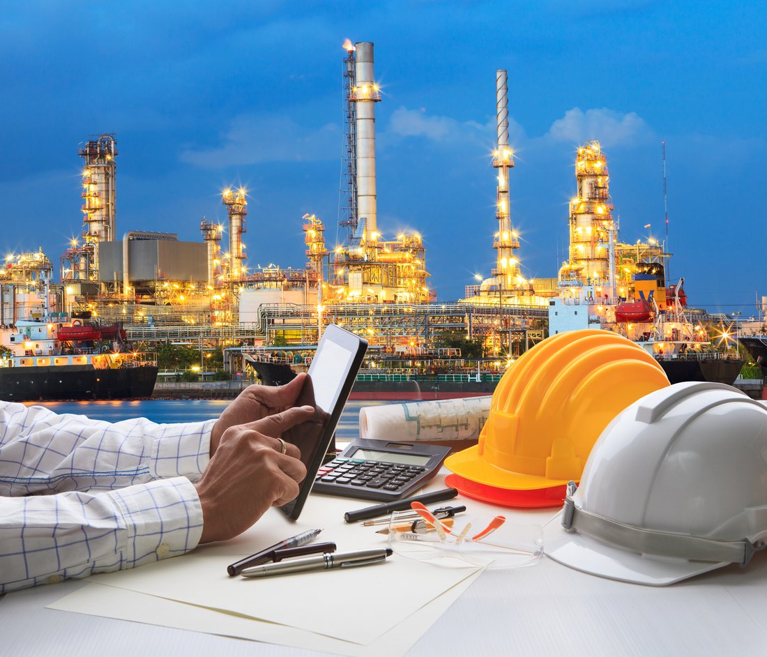 Oil and gas refinery site with tracked equipment